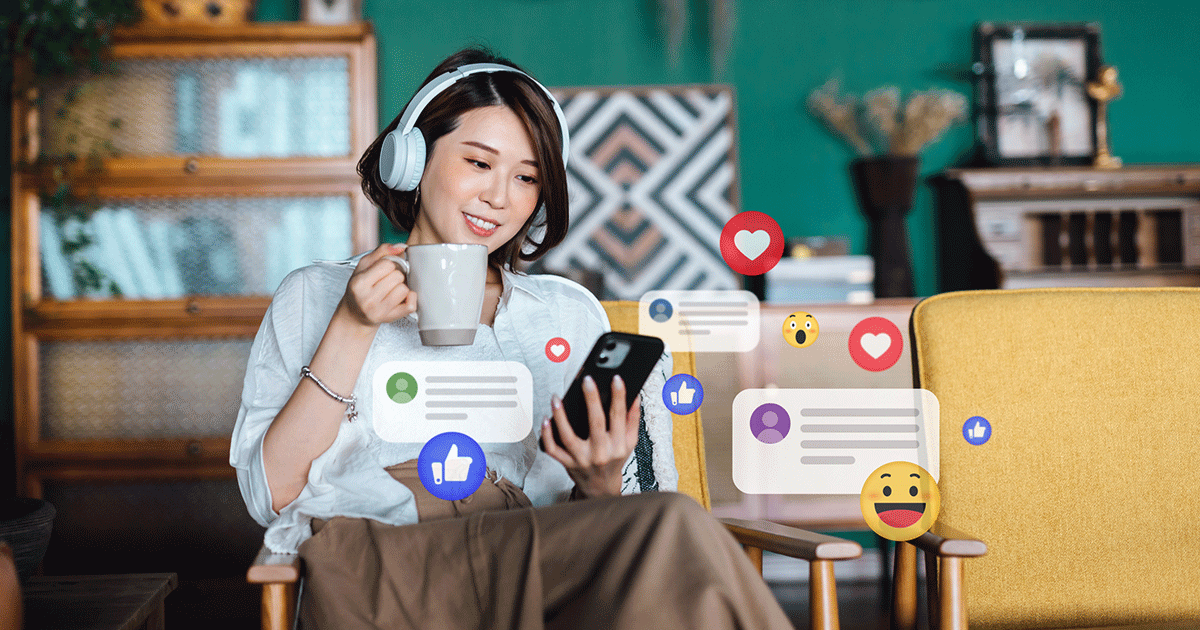 woman on phone looking at social media likes and engagements