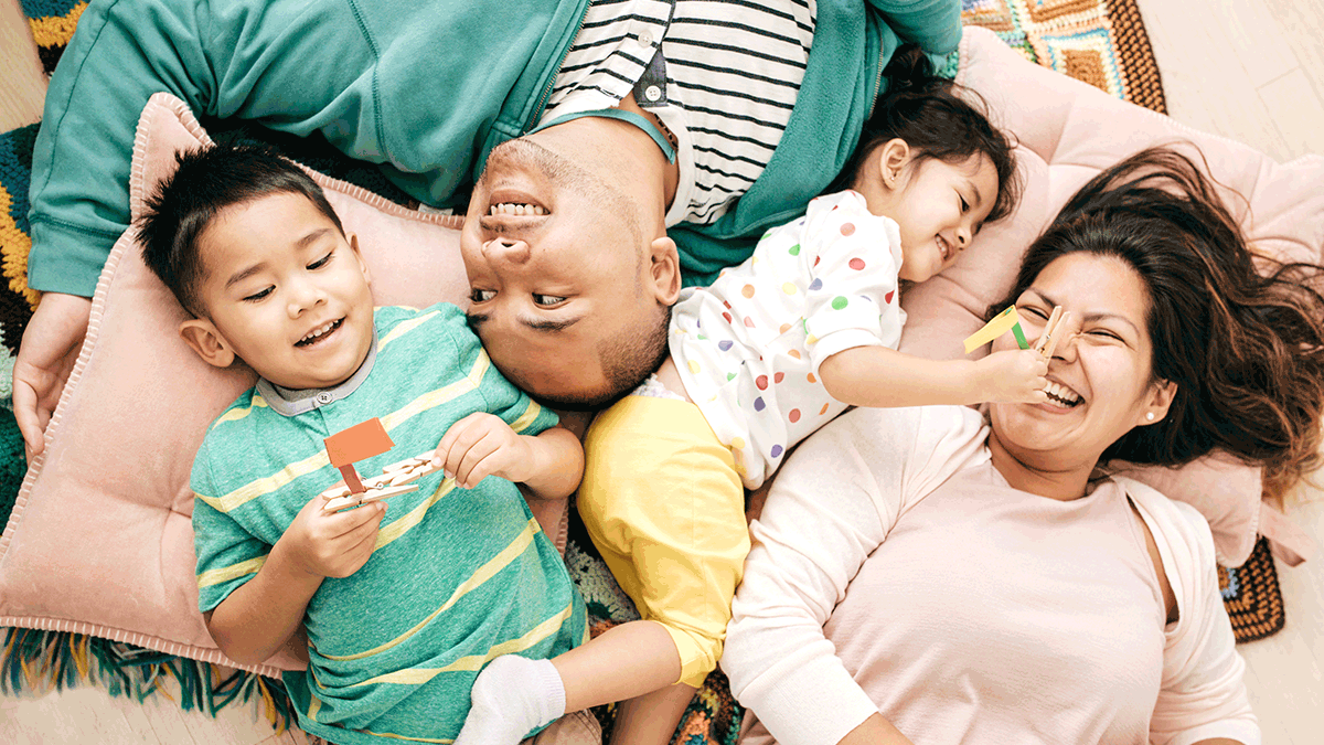 Young Hispanic family laughing together
