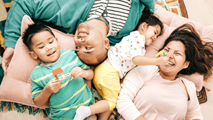 Young Hispanic family laughing together
